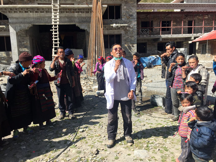 Dentist Phurbu teaching villagers how to brush their teeth | The Physician Assistant Life Dentist Phurbu teaching villagers how to brush their teeth
